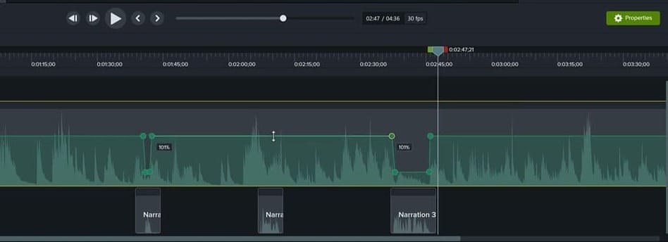 Camtasia timeline zoomed out showing three narration clips with corresponding volume dips on the music track