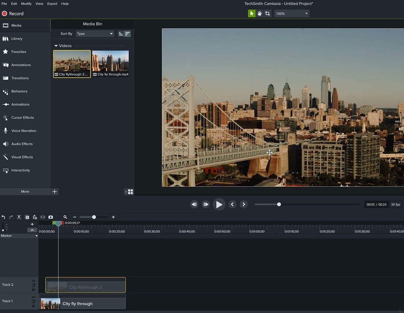 Two city flythrough video clips imported into the Media Bin and placed on separate timeline tracks for the PIP effect