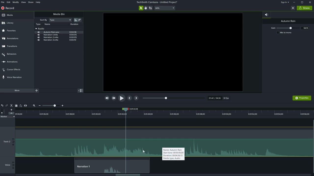 Camtasia timeline showing a music track (Autumn Rain) on Track 2 with a Voice track below containing Narration 1