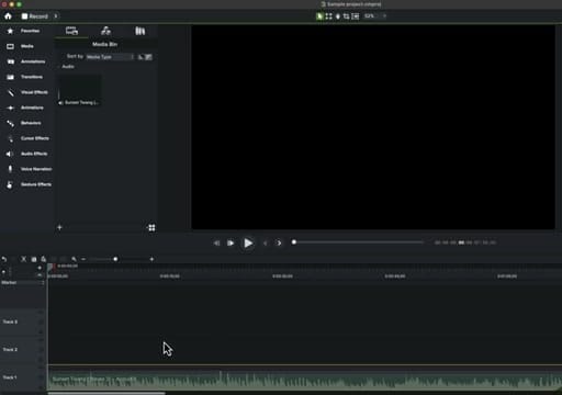 Camtasia workspace with audio file in Media Bin, timeline below, and Properties panel with Audiate integration on the right